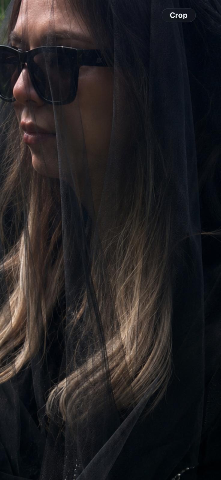 Nazila — black veil side portrait